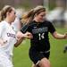 Huron senior Emma Mees races after a ball on Tuesday, April 23. Daniel Brenner I AnnArbor.com